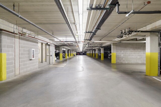 5650 Boone Ave N, New Hope, MN 55428 - parking deck featuring concrete block wall