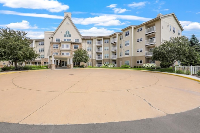 5650 Boone Ave N, New Hope, MN 55428 - view of apartment building / complex with curved driveway and a wall mounted AC