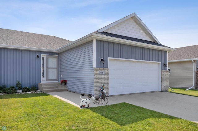 3364 27th St S, Moorhead, MN 56560 - view of front of home featuring brick siding, a front yard, roof with shingles, and driveway