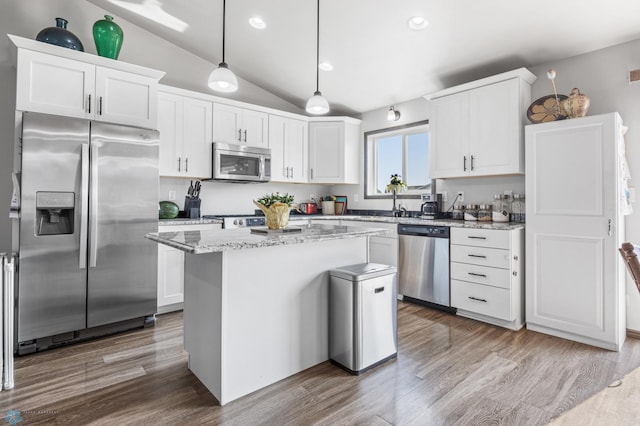 3364 27th St S, Moorhead, MN 56560 - kitchen with stainless steel appliances, lofted ceiling, white cabinetry, wood finished floors, and recessed lighting