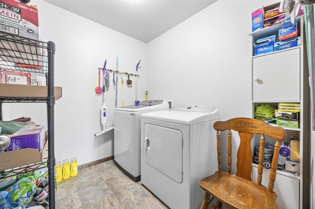 3364 27th St S, Moorhead, MN 56560 - washroom featuring washing machine and dryer, cabinet space, and light stone finish flooring