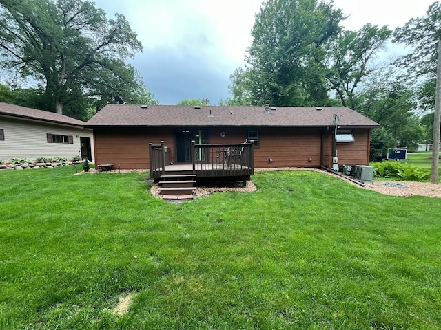 5940 150th Ave NE, New London Twp, MN 56288 - rear view of house with a wooden deck and a yard