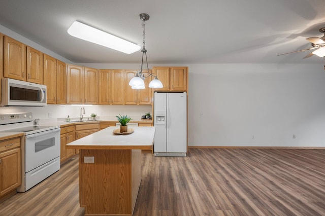 9165 Comstock Ln N Unit 106, Maple Grove, MN 55311 - kitchen with white appliances, wood finished floors, a kitchen island, light countertops, and hanging light fixtures