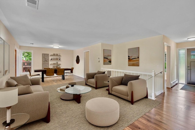 101 Sunset Dr S, Minnetonka, MN 55305 - living room featuring wood finished floors and a baseboard heating unit