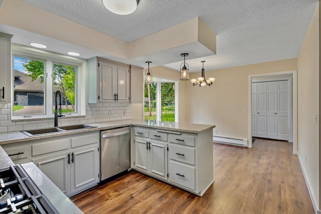 101 Sunset Dr S, Minnetonka, MN 55305 - kitchen with dishwasher, a peninsula, a baseboard radiator, dark wood-style floors, and plenty of natural light