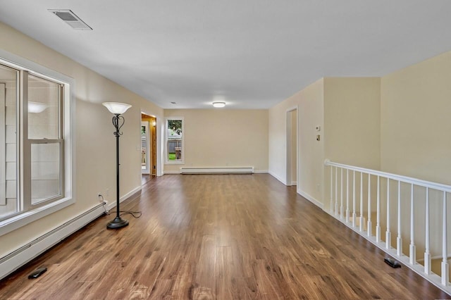 101 Sunset Dr S, Minnetonka, MN 55305 - empty room with a baseboard radiator, baseboard heating, and wood finished floors
