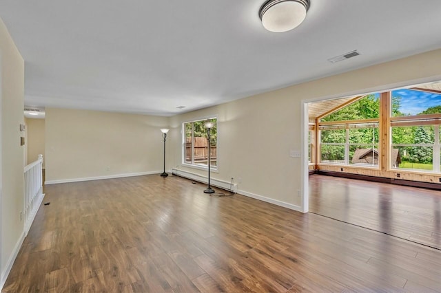 101 Sunset Dr S, Minnetonka, MN 55305 - unfurnished living room with wood finished floors and a baseboard heating unit