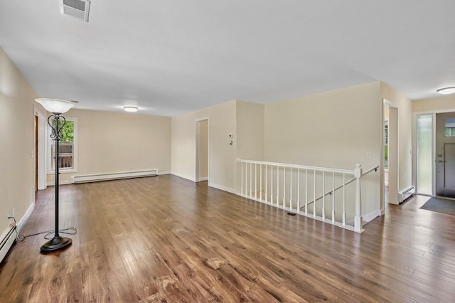 101 Sunset Dr S, Minnetonka, MN 55305 - unfurnished living room with a baseboard radiator, wood finished floors, and baseboard heating