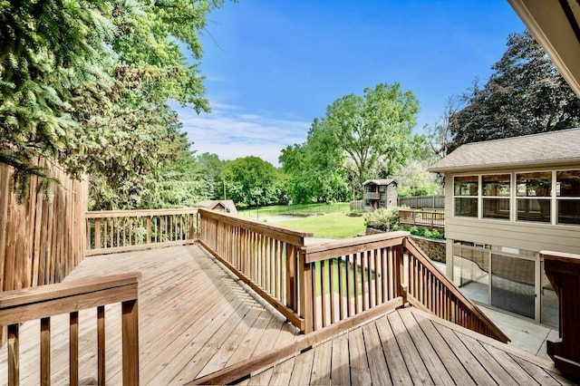 101 Sunset Dr S, Minnetonka, MN 55305 - wooden terrace featuring a fenced backyard and a storage unit