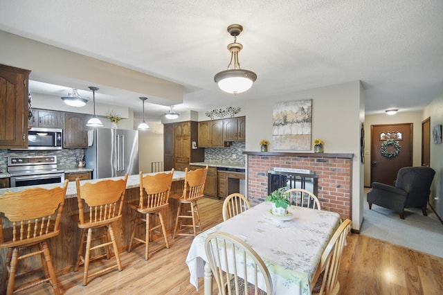 20128 554th St, Concord Twp, MN 55985 - dining space featuring light wood-style floors