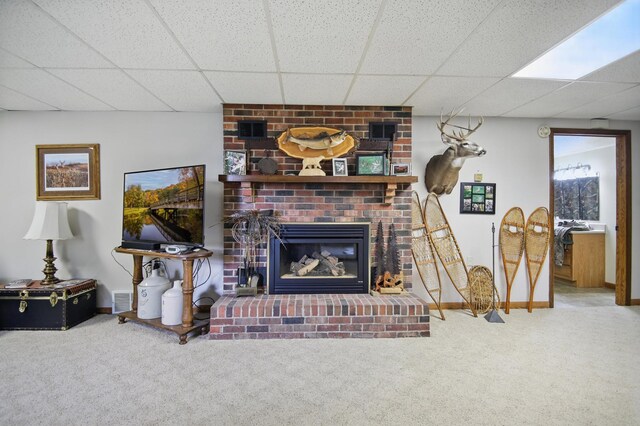 20128 554th St, Concord Twp, MN 55985 - carpeted living area with a fireplace and a drop ceiling