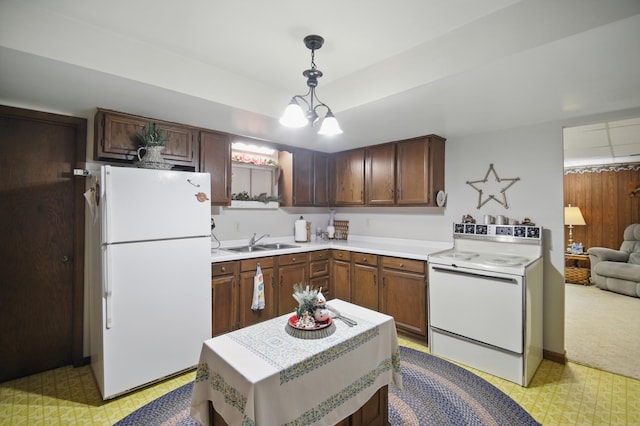 20128 554th St, Concord Twp, MN 55985 - kitchen featuring white appliances, light countertops, light flooring, decorative light fixtures, and a chandelier