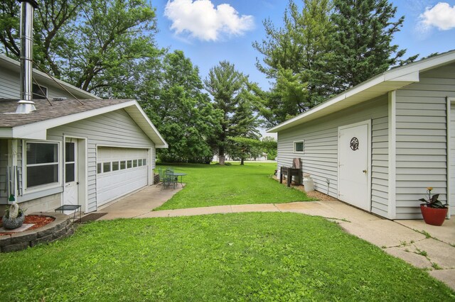 20128 554th St, Concord Twp, MN 55985 - view of green lawn with a detached garage