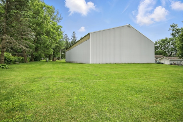20128 554th St, Concord Twp, MN 55985 - view of grassy yard with a pole building and an outdoor structure