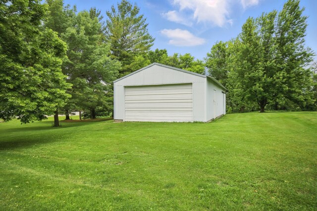 20128 554th St, Concord Twp, MN 55985 - view of green lawn featuring an outdoor structure and a garage