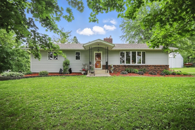 20128 554th St, Concord Twp, MN 55985 - ranch-style house featuring a chimney, a front yard, and brick siding