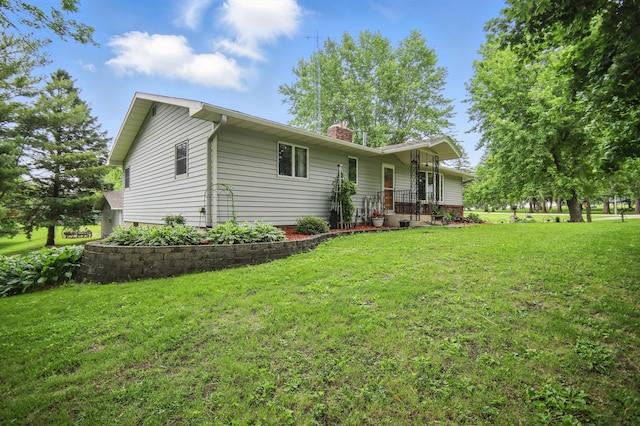 20128 554th St, Concord Twp, MN 55985 - view of front of home featuring a chimney and a front lawn
