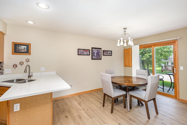 4426 Lakeshore Ter, Eagan, MN 55122 - dining room featuring light wood-style flooring, a chandelier, and recessed lighting