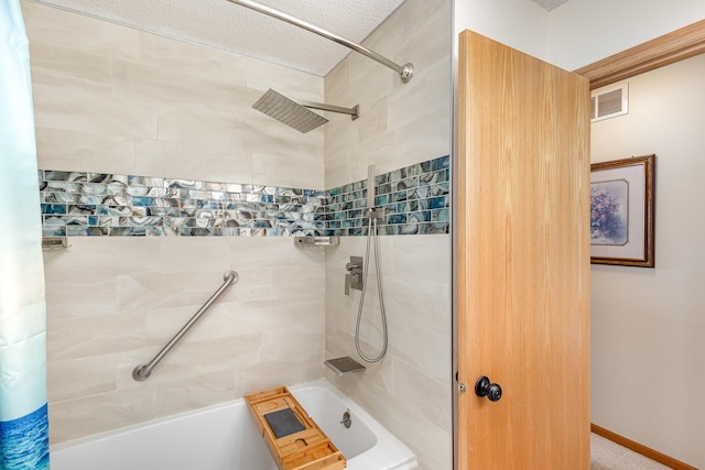 4426 Lakeshore Ter, Eagan, MN 55122 - full bath featuring shower / bath combo with shower curtain and a textured ceiling