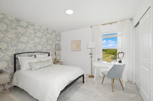 26639 8th St W, Zimmerman, MN 55398 - bedroom with wallpapered walls, light colored carpet, and a closet