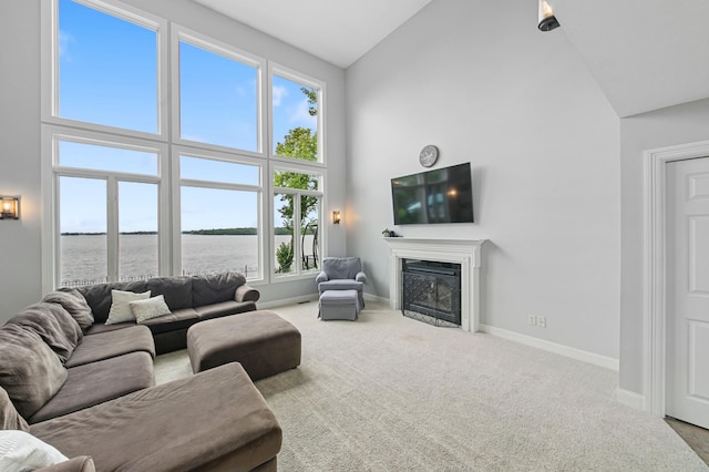 10460 Kismet Isle, Chisago Lake Twp, MN 55013 - carpeted living area featuring high vaulted ceiling and a premium fireplace