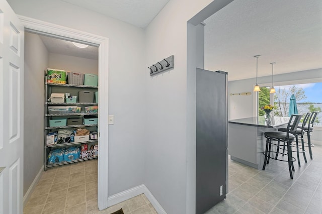 10460 Kismet Isle, Chisago Lake Twp, MN 55013 - hall with a textured ceiling and baseboards