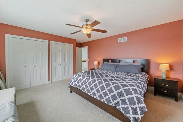 10460 Kismet Isle, Chisago Lake Twp, MN 55013 - carpeted bedroom featuring multiple closets and ceiling fan