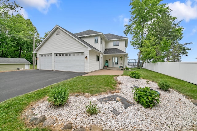 10460 Kismet Isle, Chisago Lake Twp, MN 55013 - traditional-style home featuring driveway, an attached garage, and a shingled roof