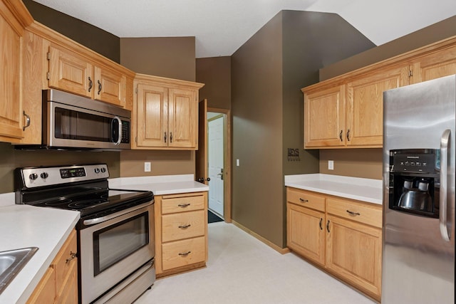 22087 Jasmine Way, Rogers, MN 55374 - kitchen featuring stainless steel appliances, light countertops, light brown cabinets, and light floors