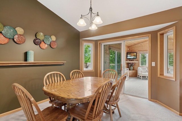 22087 Jasmine Way, Rogers, MN 55374 - dining area with vaulted ceiling, light colored carpet, and a chandelier