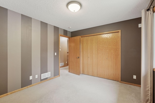 22087 Jasmine Way, Rogers, MN 55374 - unfurnished bedroom featuring a textured ceiling, a closet, and carpet floors