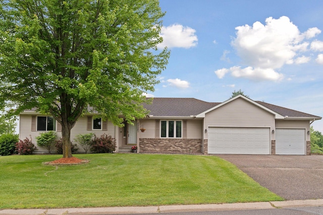22087 Jasmine Way, Rogers, MN 55374 - ranch-style house featuring asphalt driveway, a garage, a front lawn, brick siding, and roof with shingles