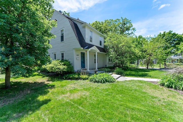 4001 Sheridan Ave S, Minneapolis, MN 55410 - view of front of house featuring a front yard and a shingled roof