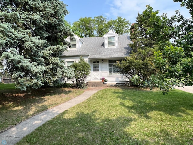 1410 4th St S, Moorhead, MN 56560 - new england style home with a front lawn and a shingled roof