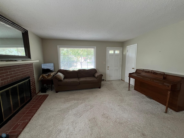 1410 4th St S, Moorhead, MN 56560 - carpeted living room featuring a brick fireplace and a textured ceiling