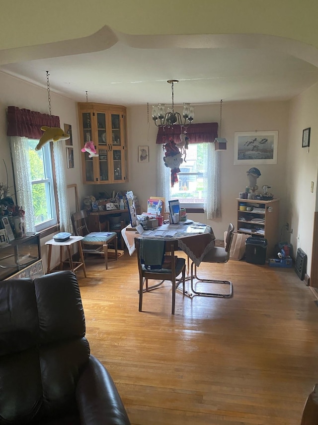 406 N Rd, Cloquet, MN 55720 - dining space with light wood finished floors and a chandelier