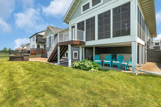 1301 20th Ave S, Sartell, MN 56377 - rear view of house with stairway, a patio, and a deck
