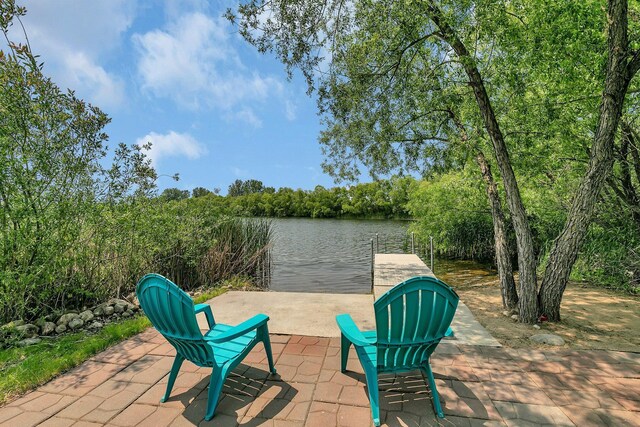 1301 20th Ave S, Sartell, MN 56377 - view of patio featuring a water view and a dock