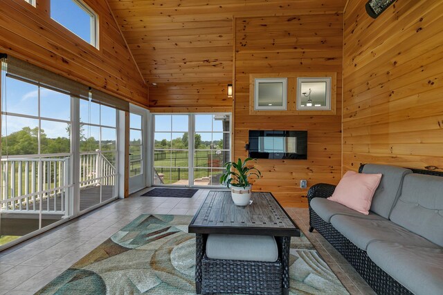 1301 20th Ave S, Sartell, MN 56377 - tiled living room with healthy amount of natural light, high vaulted ceiling, and wood walls