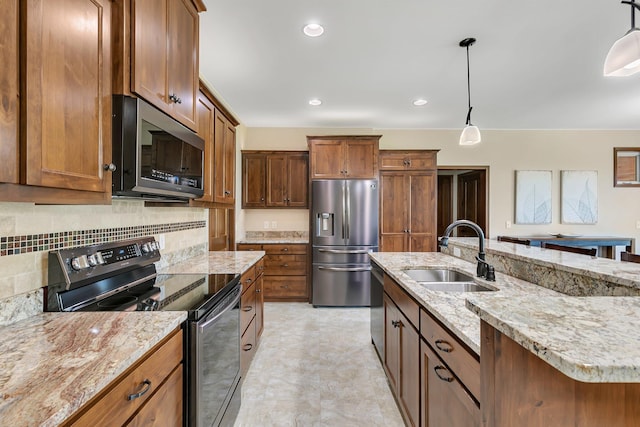 1301 20th Ave S, Sartell, MN 56377 - kitchen with appliances with stainless steel finishes, brown cabinets, hanging light fixtures, backsplash, and recessed lighting