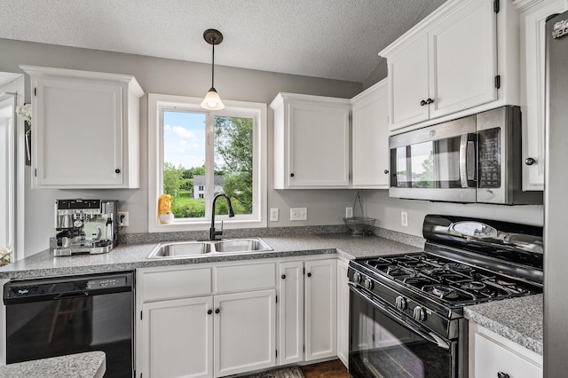 19921 204th Ave, Big Lake, MN 55309 - kitchen featuring black appliances, white cabinets, a textured ceiling, decorative light fixtures, and light countertops