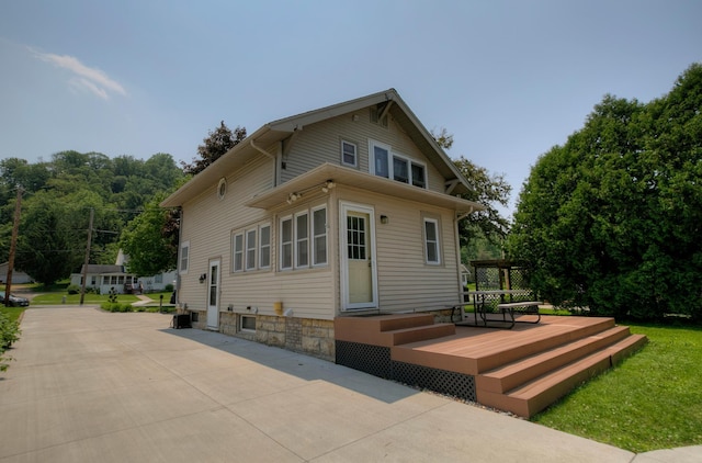 544 7th St, Red Wing, MN 55066 - back of house with a wooden deck