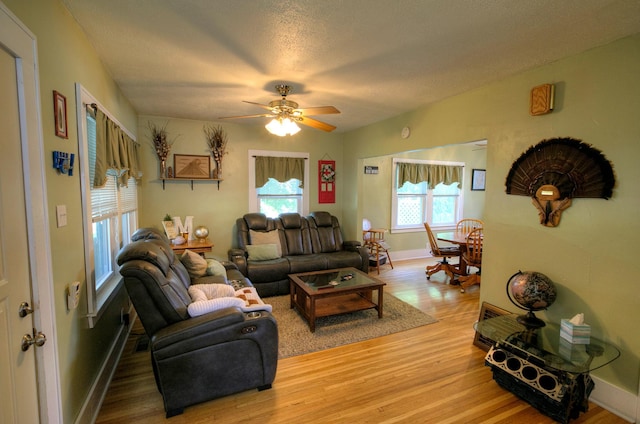 544 7th St, Red Wing, MN 55066 - living room featuring light wood finished floors, ceiling fan, and a textured ceiling