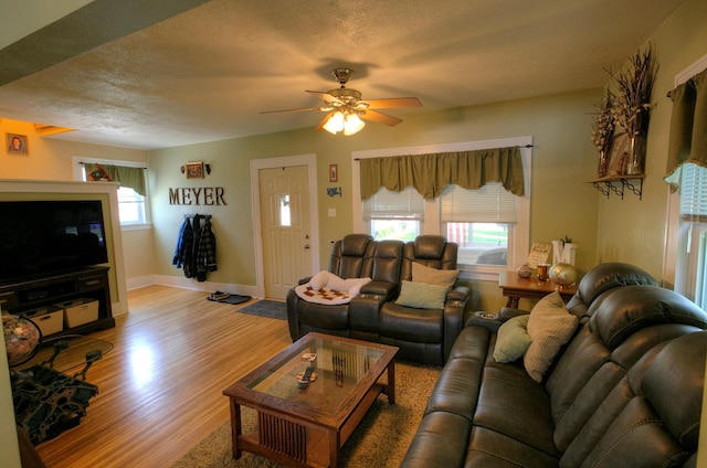 544 7th St, Red Wing, MN 55066 - living area with light wood-type flooring, ceiling fan, and a textured ceiling