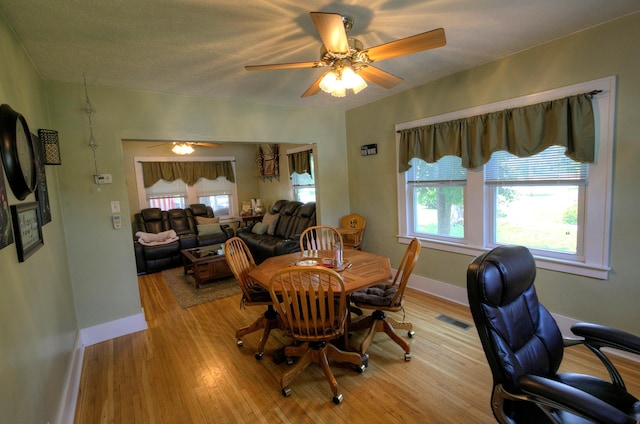 544 7th St, Red Wing, MN 55066 - dining space with a ceiling fan, light wood-type flooring, and a desk