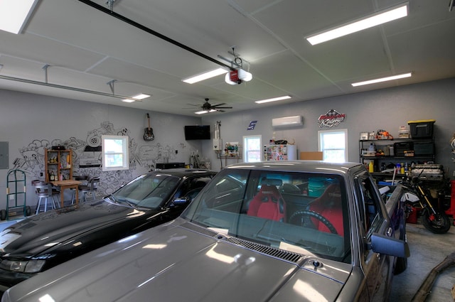 544 7th St, Red Wing, MN 55066 - garage with an AC wall unit, a garage door opener, a ceiling fan, and electric panel