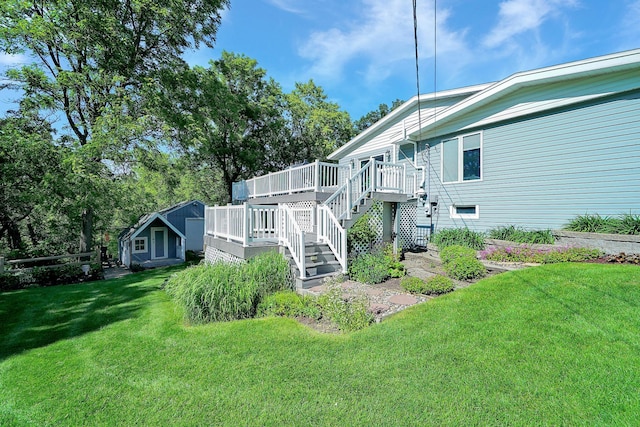 108 1st St, Kenyon, MN 55946 - view of green lawn with a deck, a storage shed, and stairway