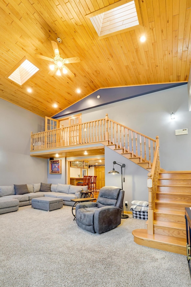 108 1st St, Kenyon, MN 55946 - living area with a skylight, carpet flooring, stairs, a ceiling fan, and wood ceiling