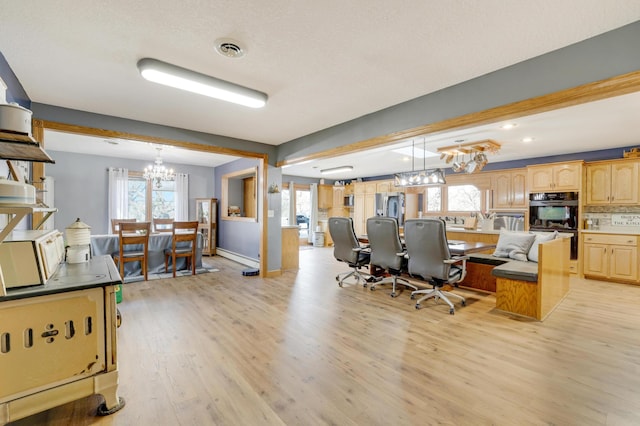 108 1st St, Kenyon, MN 55946 - office space featuring a chandelier, light wood-type flooring, healthy amount of natural light, and recessed lighting