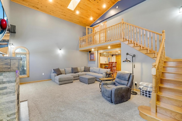 108 1st St, Kenyon, MN 55946 - carpeted living area with wood ceiling, high vaulted ceiling, stairs, baseboards, and recessed lighting